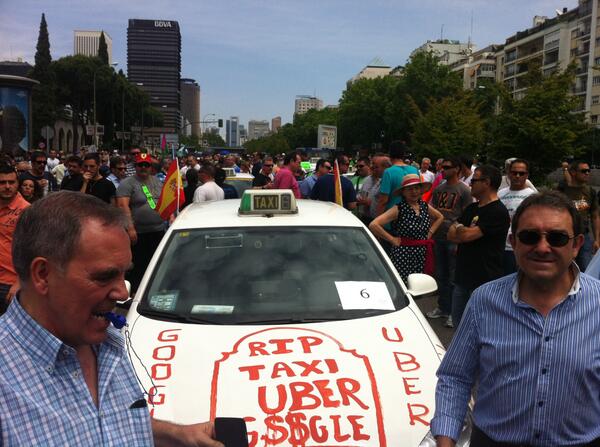 Thousands of taxi drivers just marched down Madrid's Castellana as part of their "war against @Uber" 