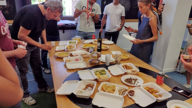 a team lunch with food from all over the world
